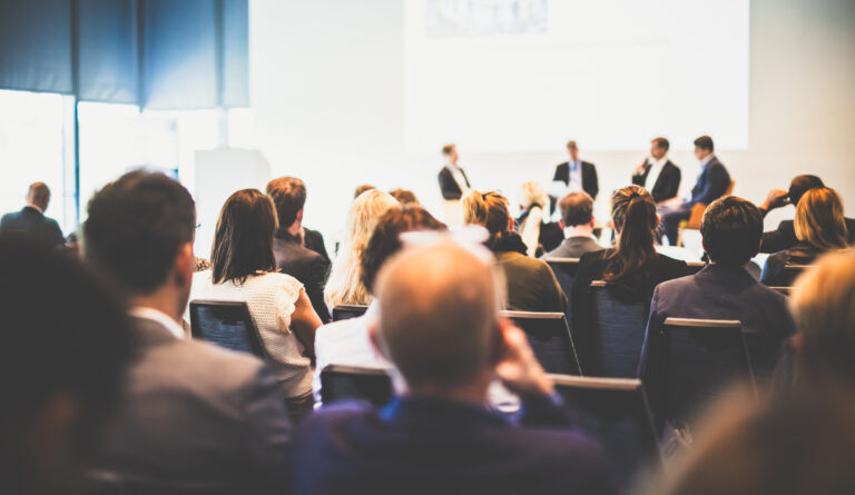 Interview and round table discussion at business convention and presentation. Audience at the conference hall