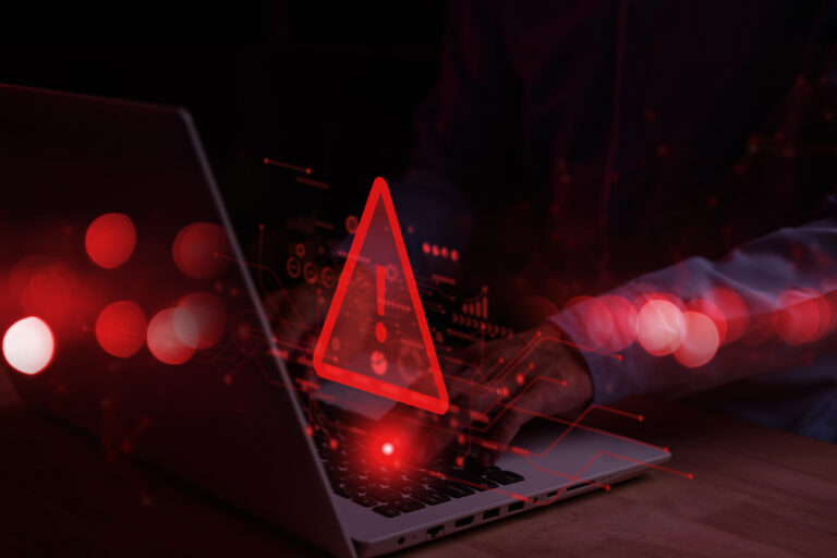 System hacked warning alert on notebook (Laptop). Cyber attack on computer network, Virus, Spyware, Malware or Malicious software. Cyber security and cybercrime. Compromised information internet